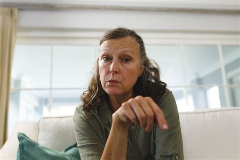 Premium Photo Senior Caucasian Woman In Living Room Sitting On Sofa