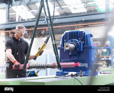 Engineer Assembling Industrial Gearbox In Engineering Factory Stock