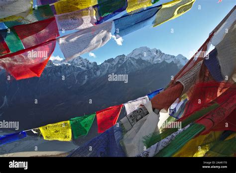 Prayer Flags In Front Of Snow Capped Mountains Of The Langtang Valley