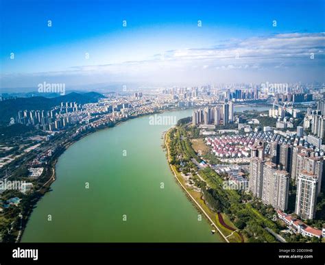 Guangxi Nanning China - Landscape of high-rise city along the river in Nanning, Guangxi, China ...