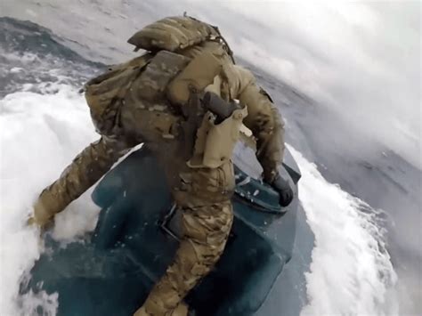 Watch Coast Guard Crewman Jumps Onto Moving Drug Submarine