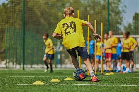 Developing Soccer Skills. Football Players, Boys in Uniforms Practicing ...