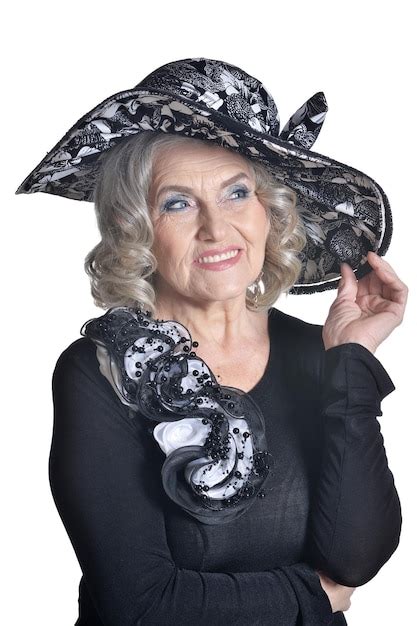 Premium Photo Happy Gorgeous Mature Woman In Hat Posing Against White