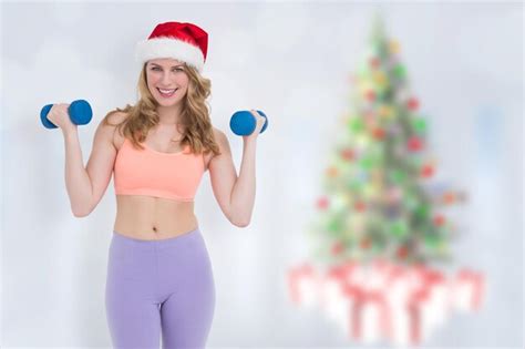 Premium Photo Festive Fit Blonde Holding Dumbbells Against Blurry