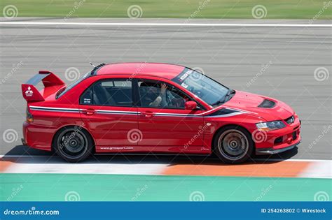 Japanese Red Mitsubishi Lancer Evolution Ix Racing On A Competition