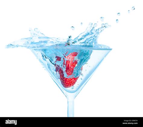 Fresh Strawberry Dropped Into Glass With Splash On White Backgrounds