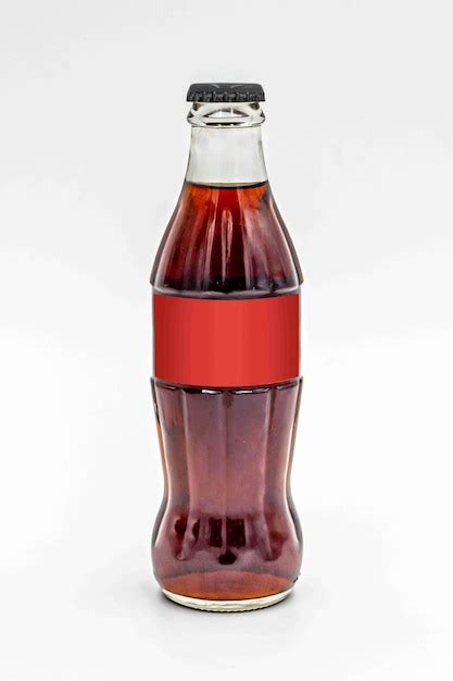 Premium Photo | A bottle of coca cola is shown with a red label.