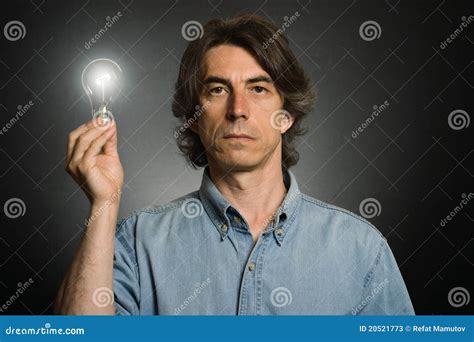 Man Holding Lighting Bulb Stock Image Image Of Intellectual 20521773