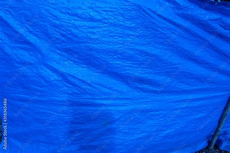 blue plastic tarp with folds Stock Photo | Adobe Stock