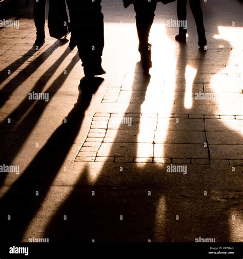 Blurry Shadow And Silhouette Of People Walking On The City Street