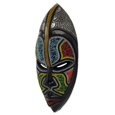 An African Mask With Multicolored Designs On It