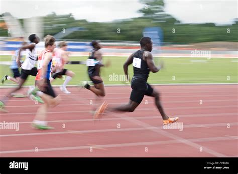 Blurred Colourful Motion And Action Of Track And Field Events 100m