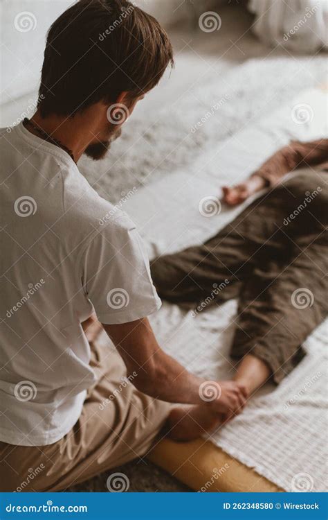 Bearded Masseur Man Doing Massage Manipulations On The Scapula Area