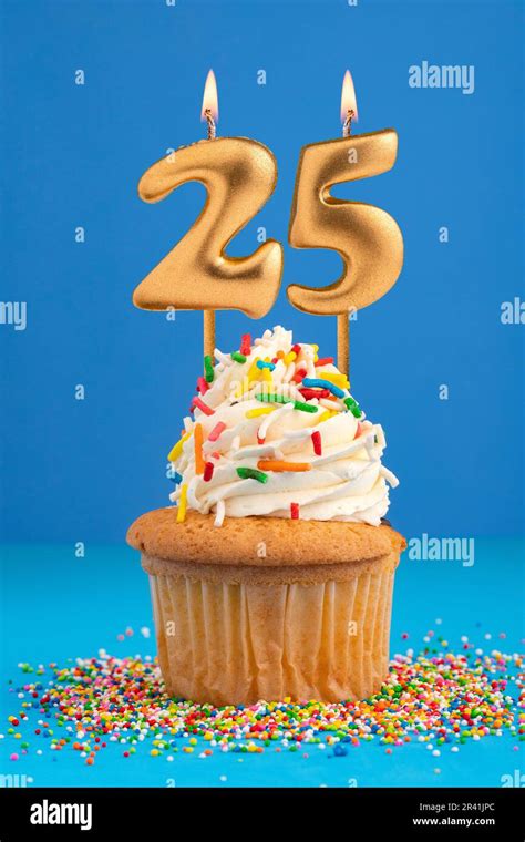 Candle number 25 - Cake birthday in blue background Stock Photo - Alamy