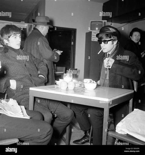 John Lennon And George Harrison Of The Beatles Pop Group Smoking