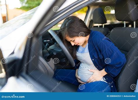 Pregnant Woman Arriving In Her Car To The Emergency Room Stock Image