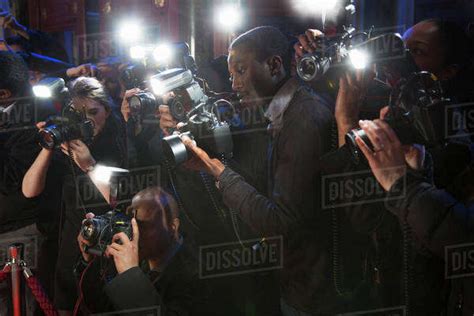 Paparazzi Using Flash Photography At Red Carpet Event Stock Photo