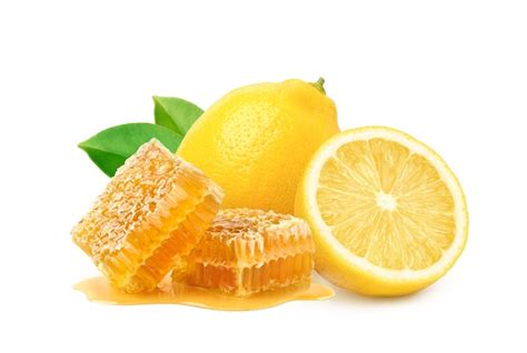 Premium Photo | Natural honeycomb with lemon fruit isolated on white