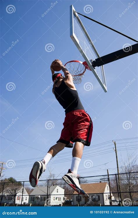 Man Dunking the Basketball stock photo. Image of ball - 10103192