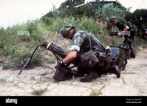 A Member Of The 82nd Airborne Division Prepares To Attach The Tracker