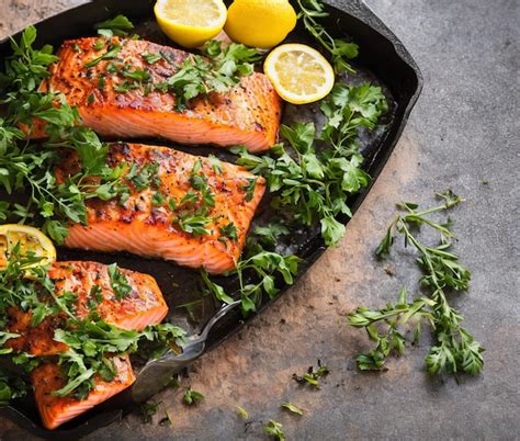 Premium Photo Salmon Fillet With Lemon And Rosemary Top View