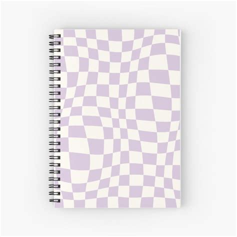 A Purple And White Spiral Notebook With An Abstract Checkerboard