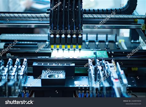pcb production shot factory machine work stock photo