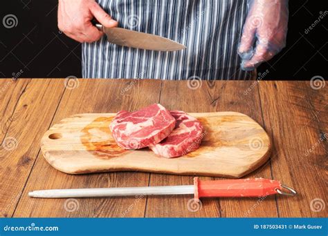 Two Fresh Raw Rib Eye Steaks On A Wooden Cutting Board Stock Image