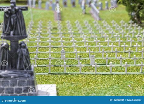 Miniature Cemetery Park With Many White Crosses Of Green Grass Stock