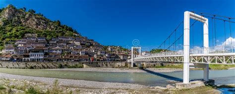 A View Along The Pedestrian Bridge Over The River Osum Towards The Old