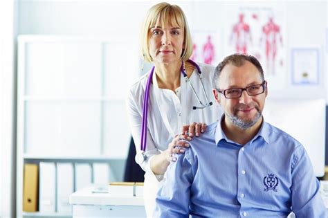 Premium Photo Doctor Talking To Her Male Patient At Office