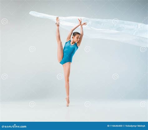 Modern Ballet Dancer Dancing In Full Body On White Studio Background