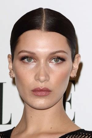 Bella Hadid Straight Dark Brown Bun Updo Hairstyle Steal Her Style