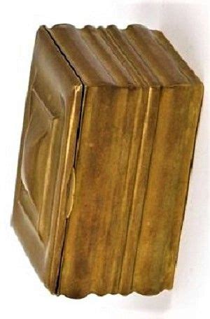 A Golden Book Shaped Like A Cube On A White Background With Clippings