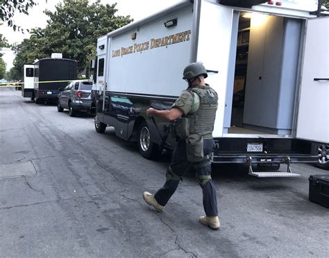 Swat Surrounds Barricaded Carjacking Suspect After Tracking Victims