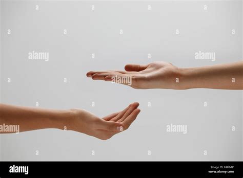 Open Palm Hand Gesture Of Male Hand Isolated Against Grey Background