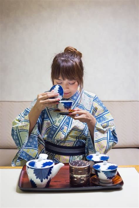 Woman Wearing Traditional Japanese Yukata Or Kimono Make A Tea Stock