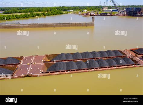 Louisville Kentucky Coal On Barges Being Pushed Up The Ohio River