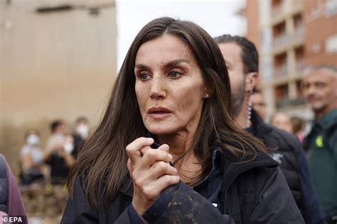 King Felipe And Queen Letizia Endure Being Pelted With Mud And Objects