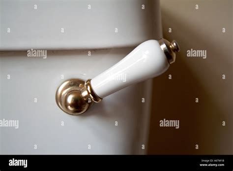 handle to flush toilet Stock Photo - Alamy