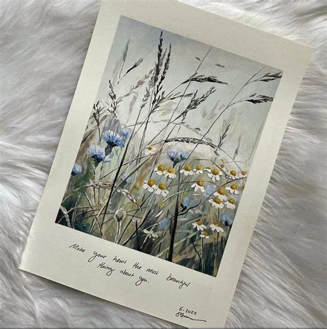 A Painting Of Wildflowers And Grass On A White Furnishing With A Poem