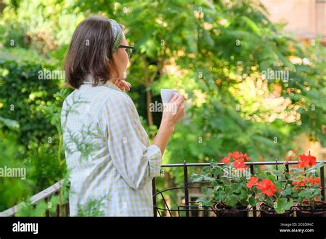 Mature Woman Relaxing On Terrace High Resolution Stock Photography And