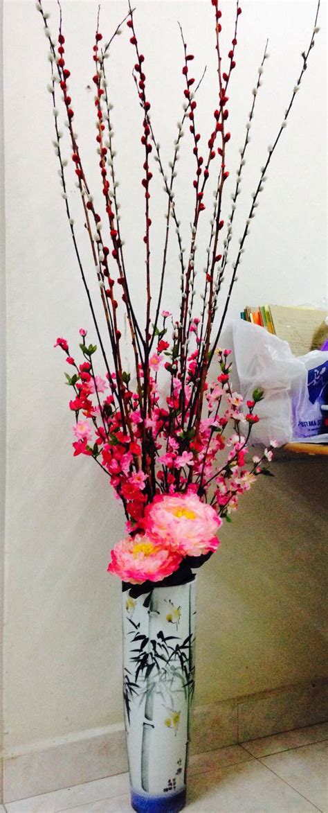 Chinese new year flower arrangement | Chinese new year flower, Flower ...