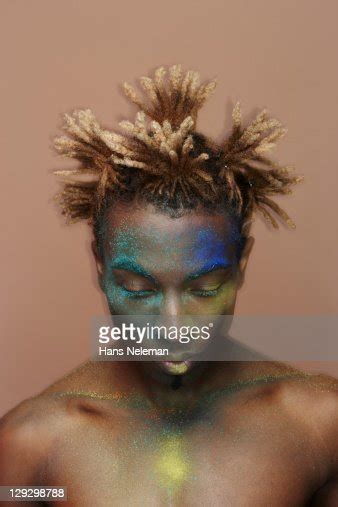 African Man With Dyed Hair And Face Paint High Res Stock Photo Getty