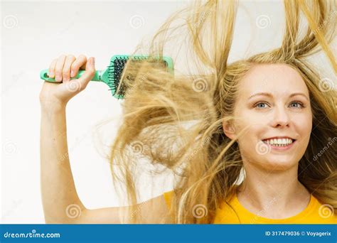 Blonde Girl Long Tangled Hair Holds Brush Stock Photo Image Of Brush Blonde 317479036