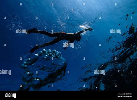 From Below Of Full Body Unrecognizable Male Diver In Snorkeling Mask