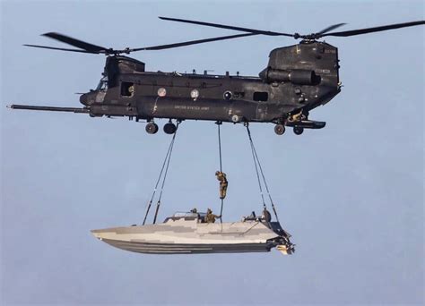 Nswdg Blue Squadron Operators Fast Roping From An Mh 47 Into A