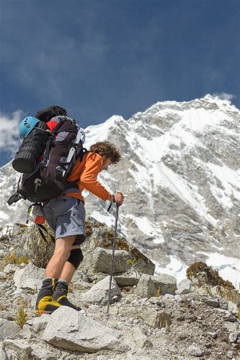 "Mountaineer Carrying Heavy Backpack Hiking At High Altitude" by ...