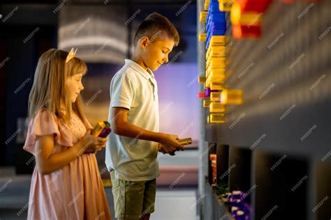 Premium Photo | Kids playing in science museum