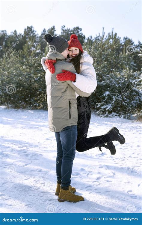 Young Happy Couple Hugs on Winter Landscapes Background. Vertical Frame Stock Image - Image of ...